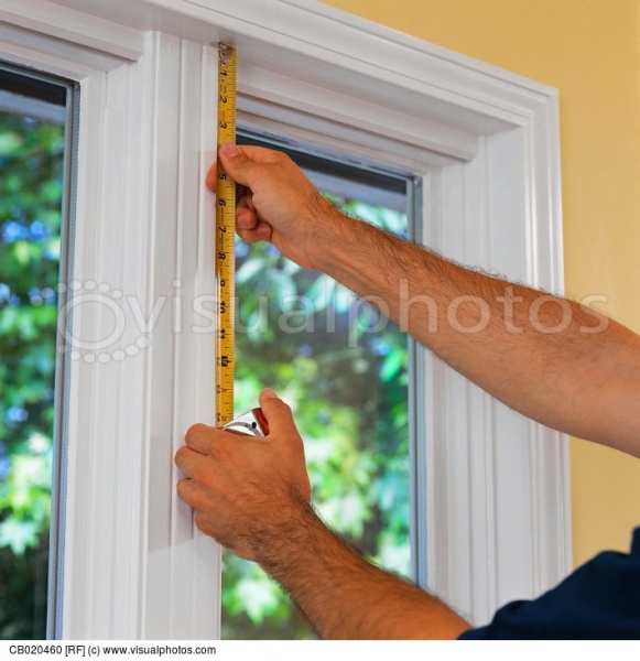 Файл:Construction-worker-measuring-house-window.jpg